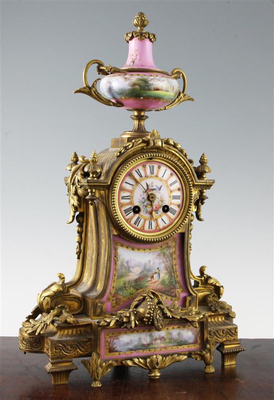 A 19th century French ormolu and Sevres style porcelain mantel clock, 17in.